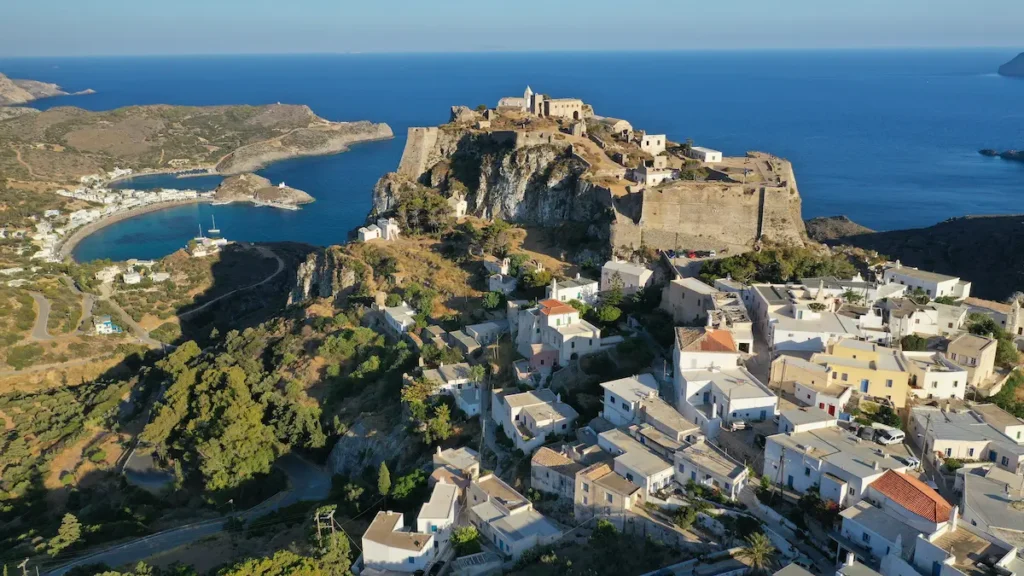 An aerial or coastal view of Kythira showing its rugged, Mediterranean landscape and traditional architecture, isolated from the mainland.