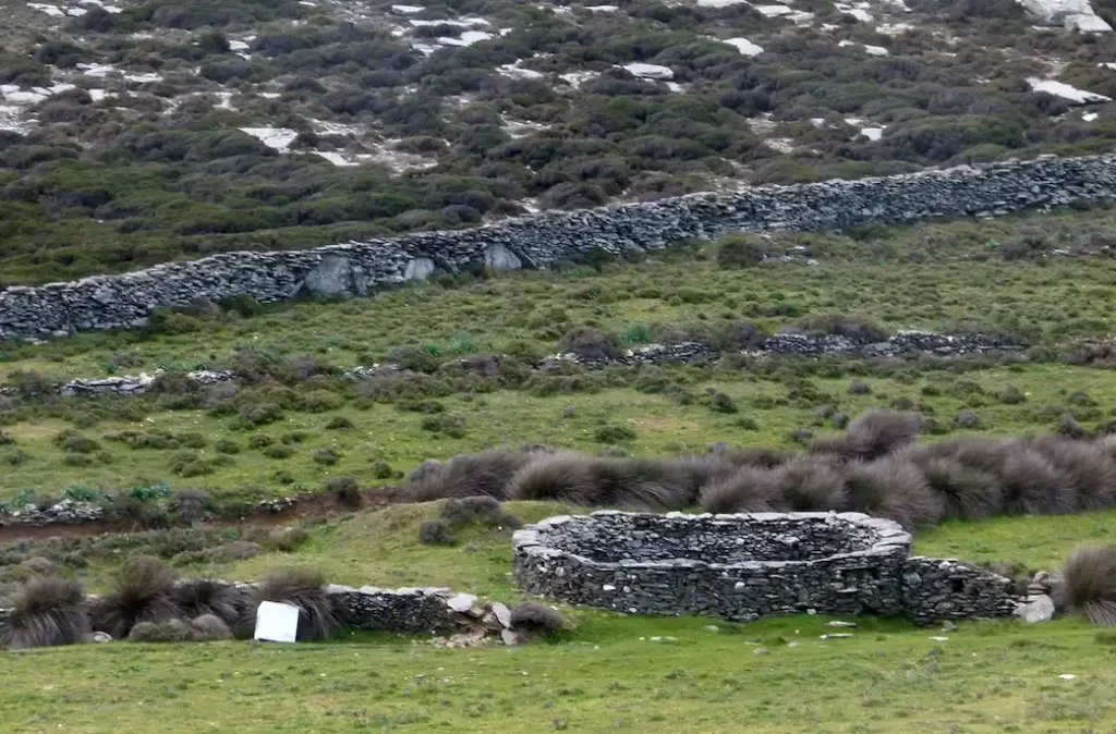 A centuries-old stone threshing floor preserved in the Tinian landscape, symbolizing the island's deep agricultural and medieval history.