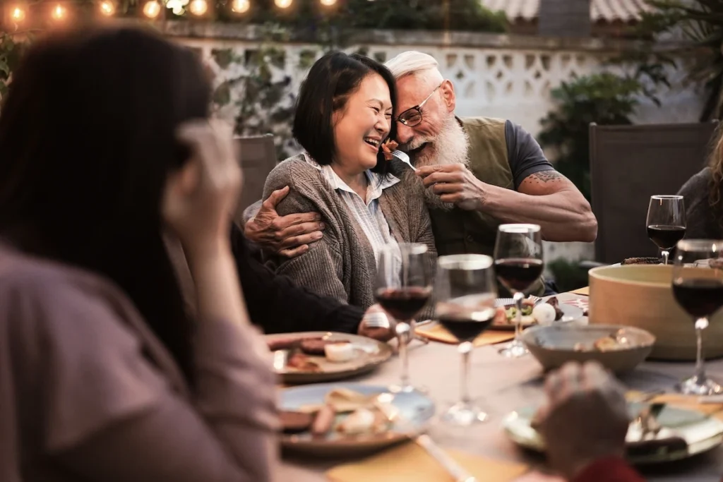 International expats enjoying a meal at a traditional Greek taverna.