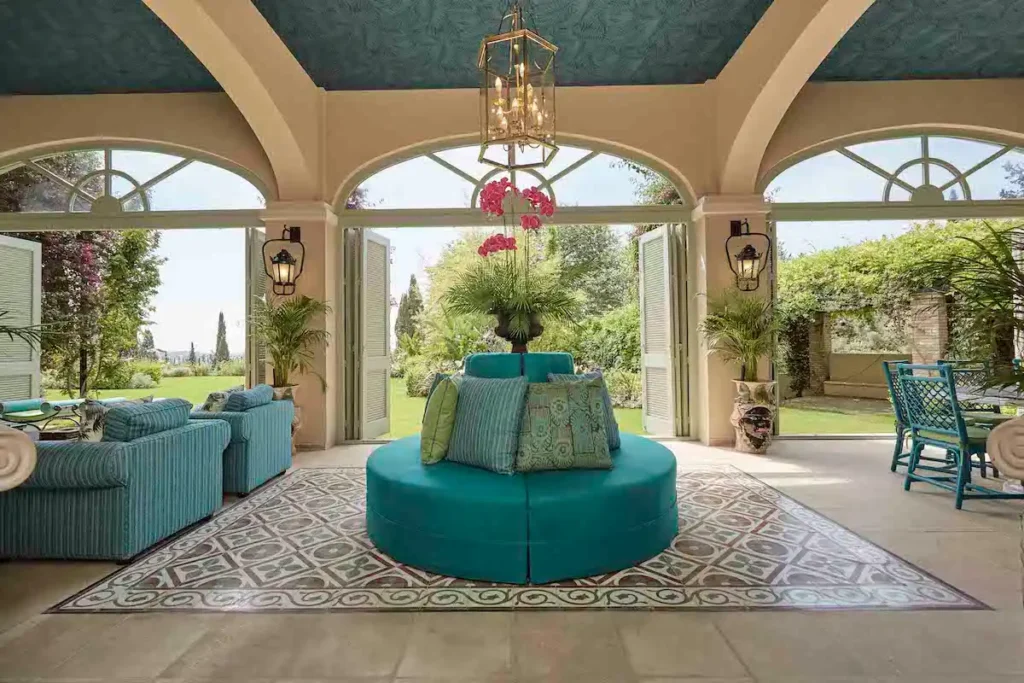 Aristocratic Corfu mansion with turquoise furniture and views of a private garden.