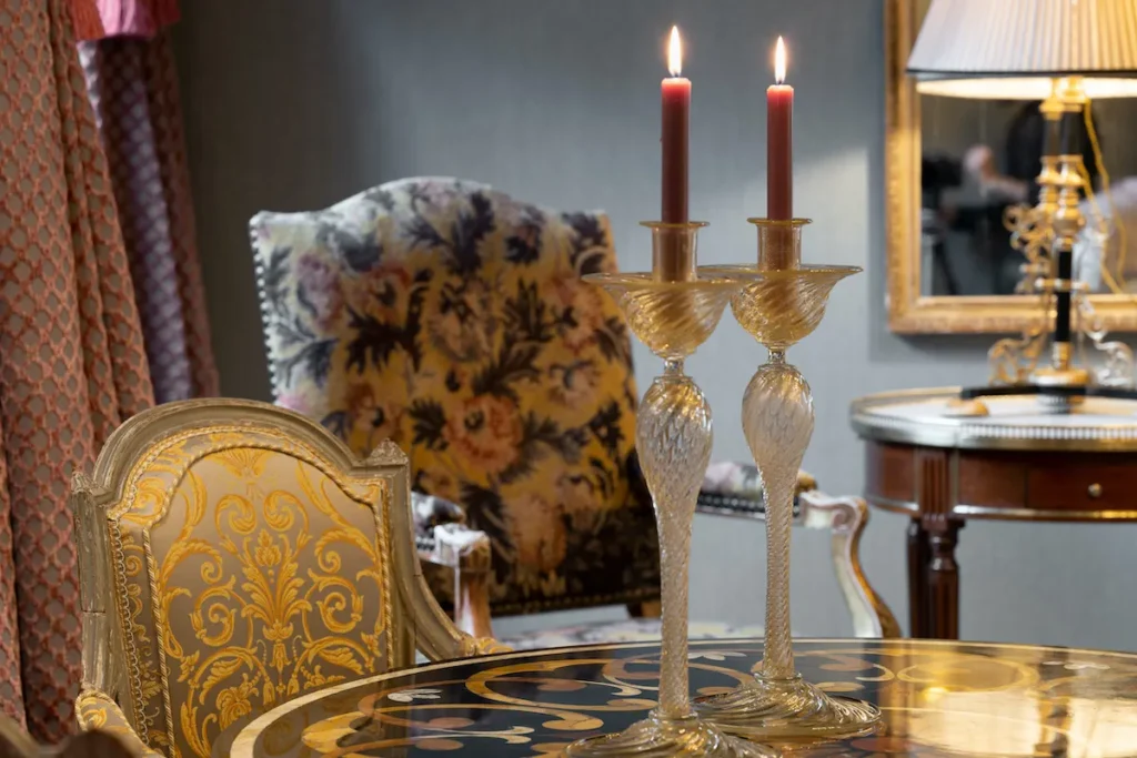 Close-up of candlelit interior details in a historic Venetian palazzo.