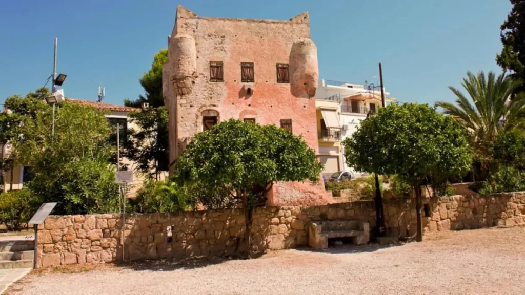 The iconic pink Tower of Markellos, a Venetian-style fortification in Aegina Town.