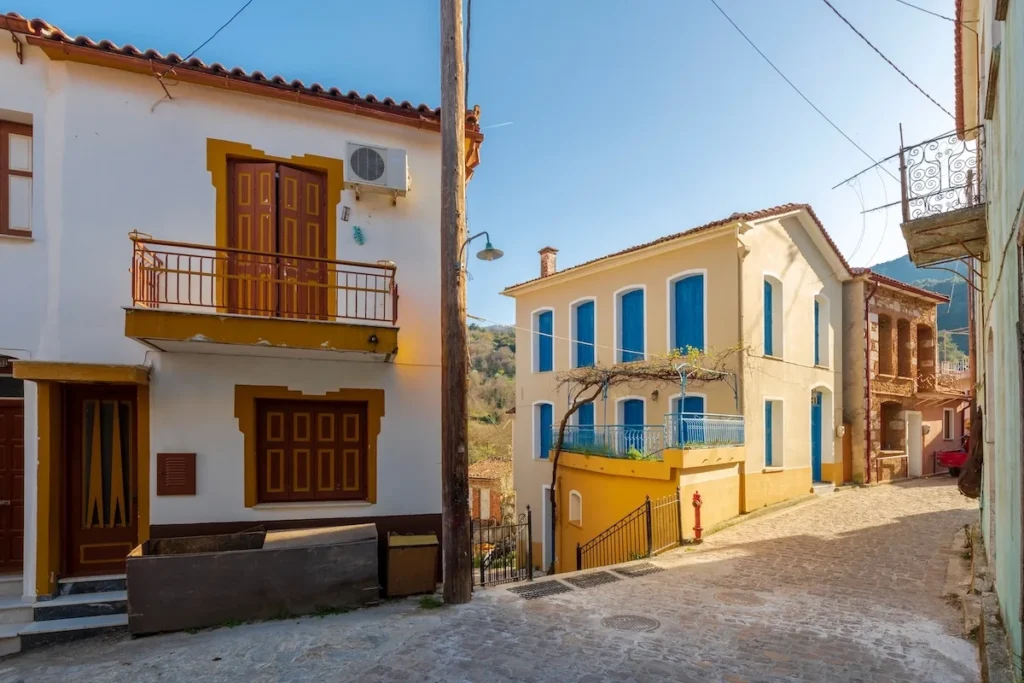Traditional village houses in Agiasos, Lesbos, representing affordable renovation opportunities in remote Greece.