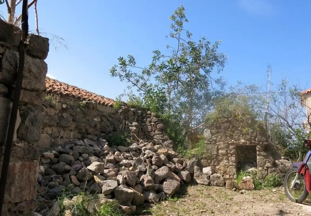 The stone ruins of the village house in Lesbos where Stella Ioannidou, the inspiration for The Schoolmistress With The Golden Eyes, once lived.