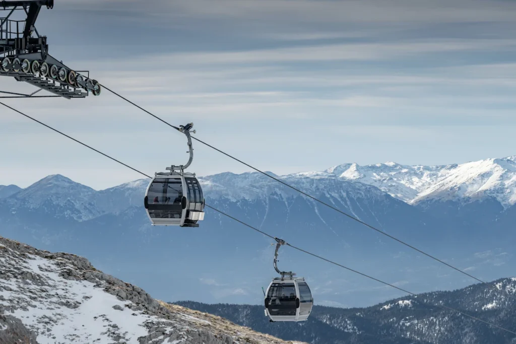 Snow-covered slopes and cable cars at the Parnassos ski resort.