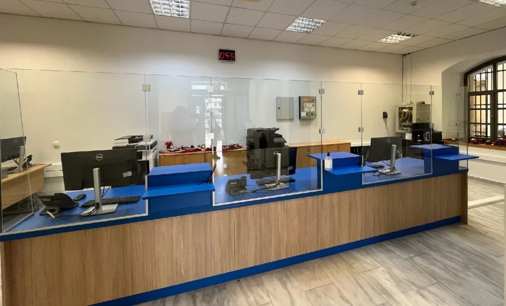 Interior view of a quiet Citizens Service Center (KEP) office featuring desks and administrative equipment.