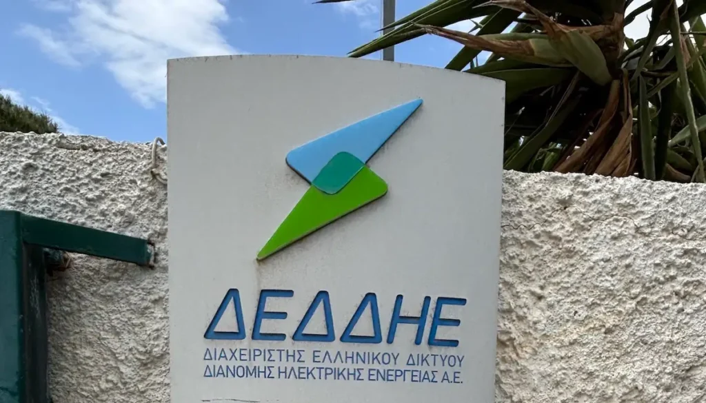 A close-up of an outdoor steel sign featuring the official DEDDIE corporate logo.