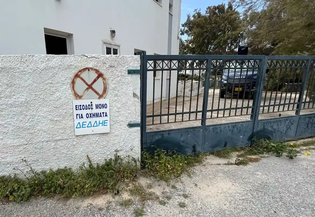 The gated entrance to a rural DEDDIE service yard with a visible "No Vehicles Allowed" sign.