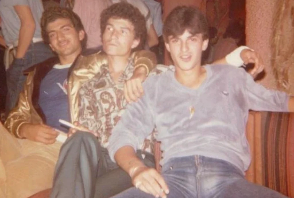 Three young Greek men at a Rhodes discotheque during the kamaki era