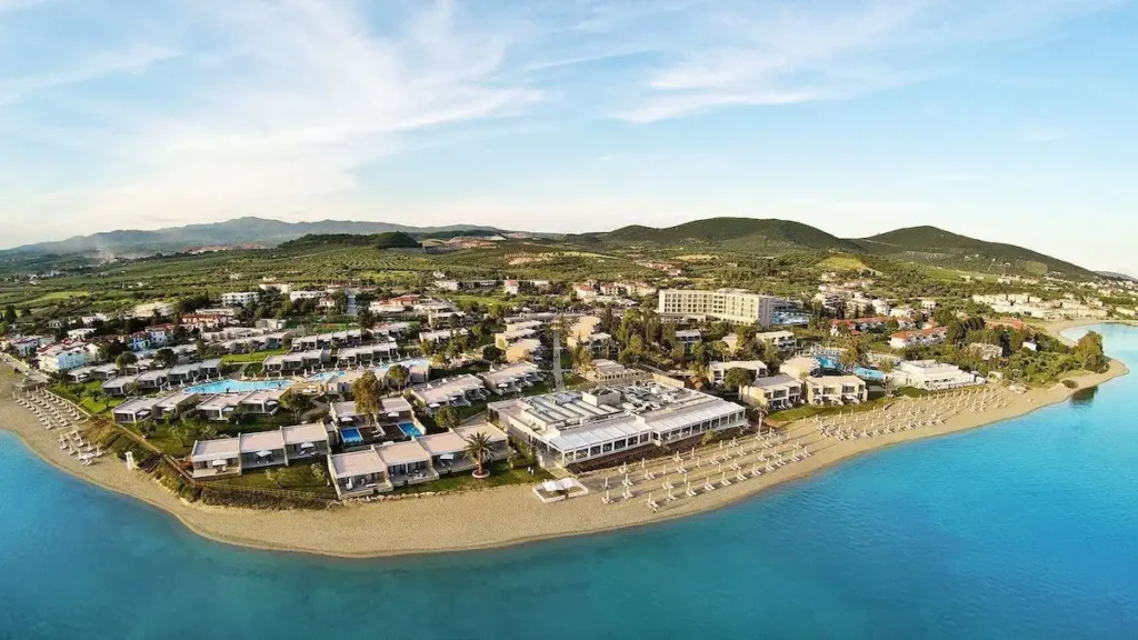 A detailed architectural scale model of the massive Atalanti Hills resort layout in Central Greece, showcasing rows of planned holiday villas and green spaces.