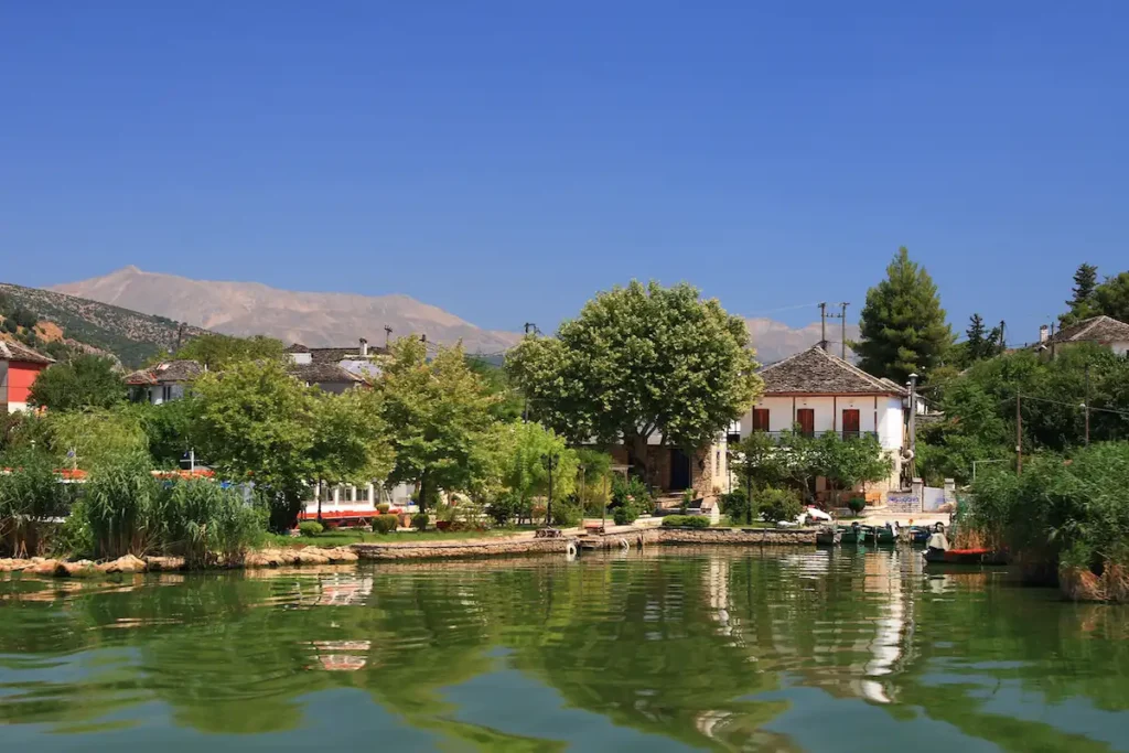 Waterfront house reflecting on the calm waters of Lake Pamvotis in Ioannina