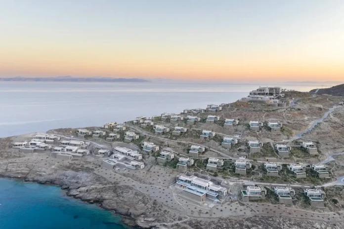 An architectural model of the ultra-luxury One&Only Kea Island private villas, displaying modern minimalist structures built into a steep Cycladic hillside.