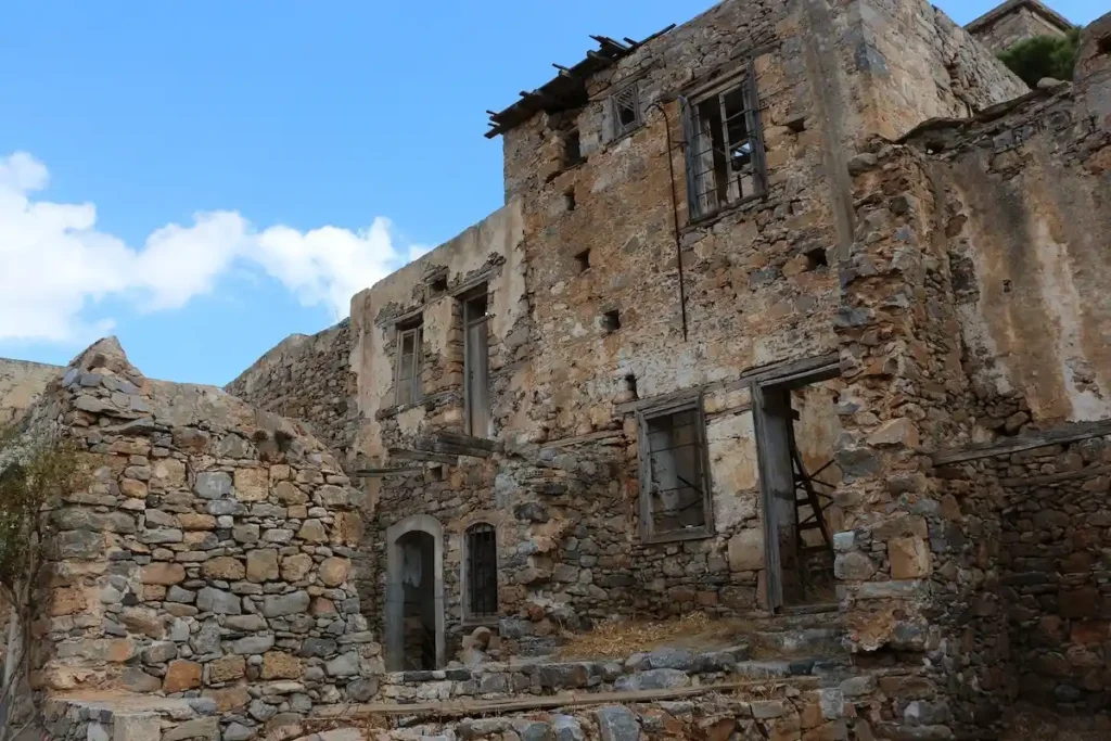 Ruins of stone houses on Spinalonga where leprosy patients lived in isolation