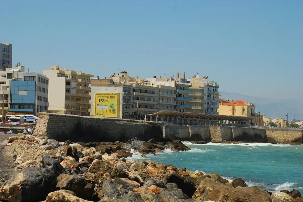 Elevated view of the Heraklion coastline showcasing urban development alongside the sea.