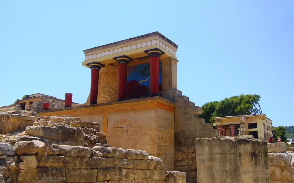 Stone ruins and restored columns of the ancient Minoan Palace of Knossos in Crete.