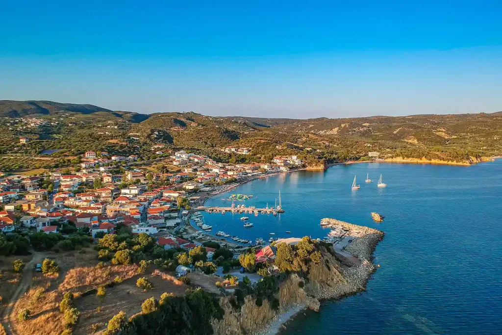 Aerial view of Finikounda, Greece, showing the coastal village, beaches, and surrounding Messinia countryside