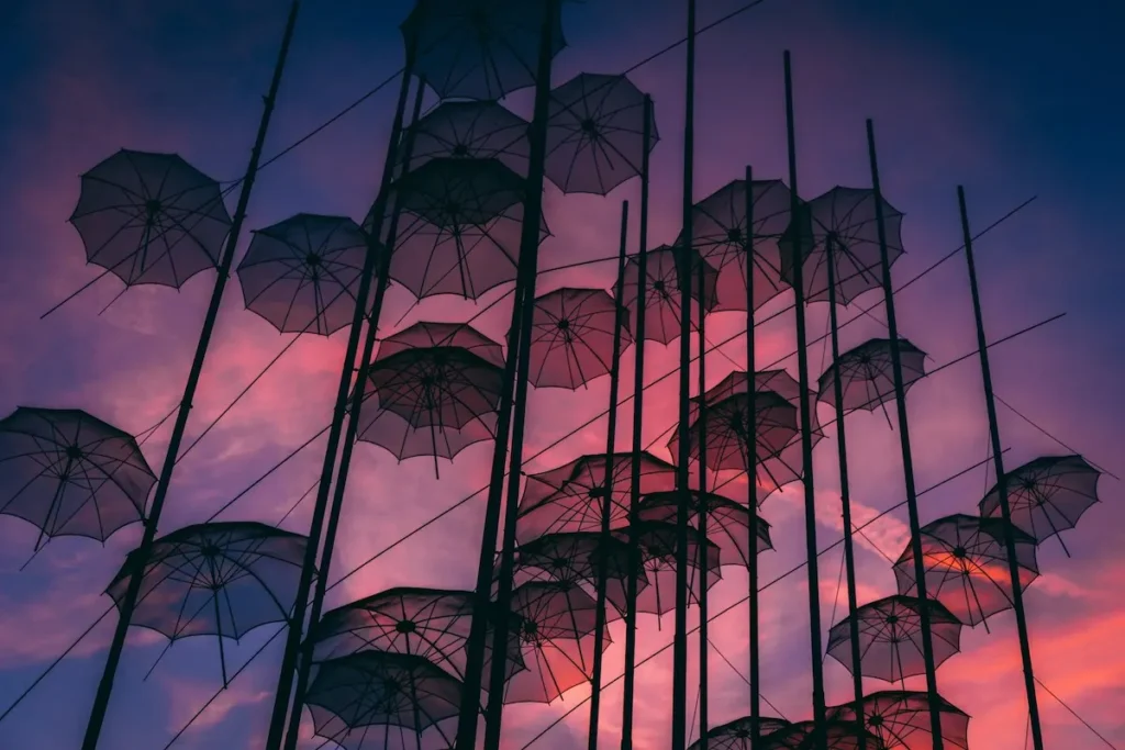 The iconic 'Umbrellas' art installation by Zongolopoulos standing against the sky along Thessaloniki's waterfront promenade.