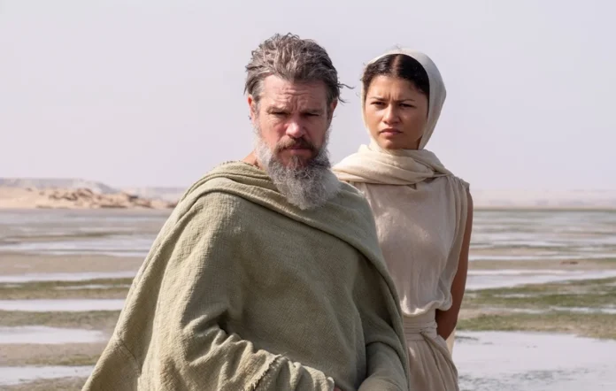 Matt Damon as Odysseus and Zendaya as Athena on Voidokilia Beach in The Odyssey
