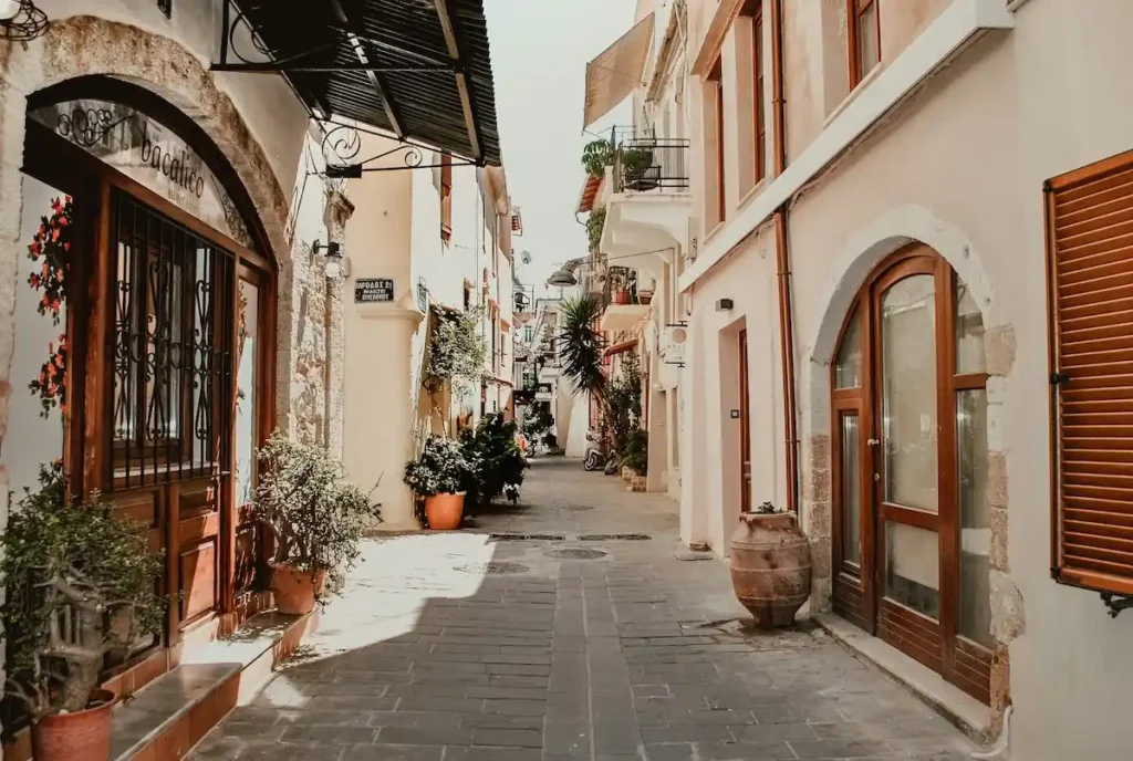 Pedestrian street lined with shops and cafés in Chania's old town