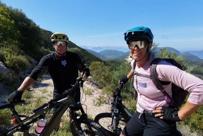 Lisa Grisley and her husband Cy standing with their bikes in the mountains above Vasiliki, Lefkada